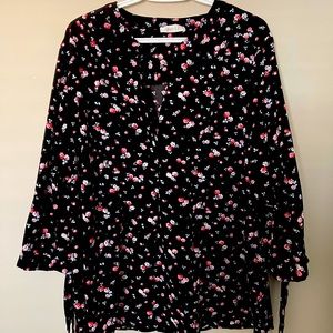 A nice black printed floral top. Only wore couple of times. Looks still good